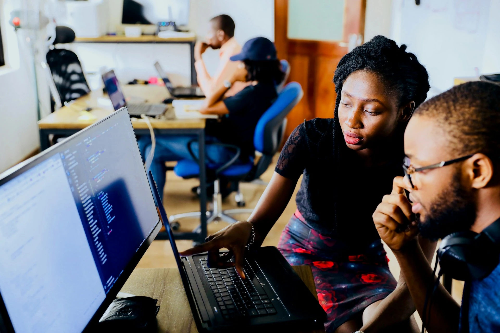 Kingdom Foundation College students collaborating in a computer lab
