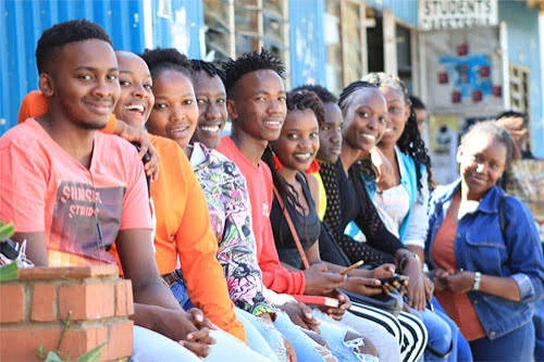 Group of Kingdom Foundation College students smiling together on campus